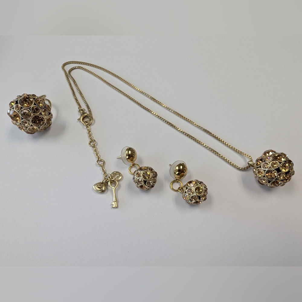 EVC FOSSIL GOLD TONE & GOLD TONE CRYSTALS NECKLACE EARRINGS & RING